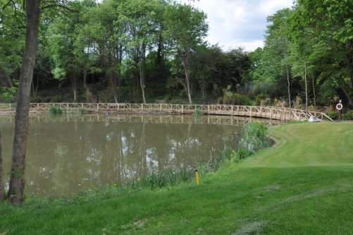 Sundridge Park Golf Club pond in June 2012 with the Diamond Jubilee bridge built from the club’s own trees by forester Terry Gladwell  DSC_0725 – Copy