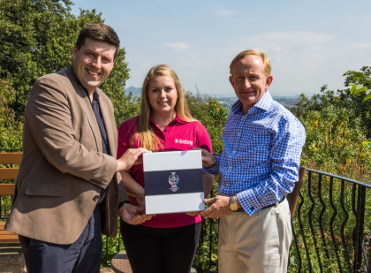 Jamie Hepburn, the Minister for Sport, Health Improvement and Mental Health, and Mike Cantlay, Chairman of VisitScotland hand over Scotlands bidding documents for The 2019 Solheim Cup to 16-year-old ClubGolf graduate Katriona Taylor