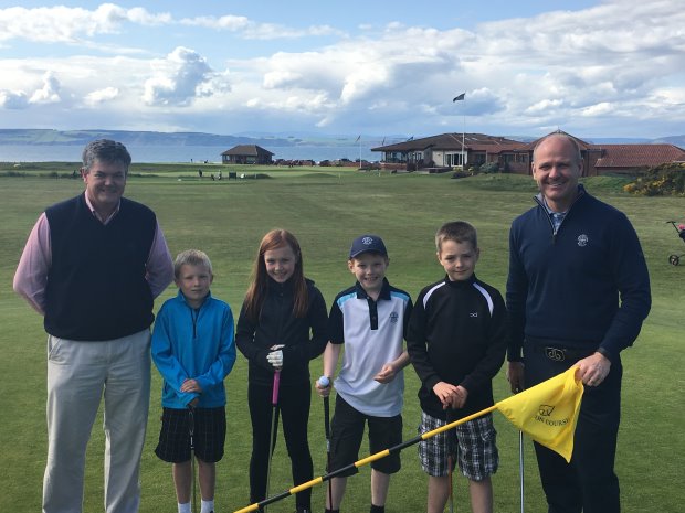 Murray Urquhart (right) with Nairn Golf Club captain Ian Hutcheson and some junior members