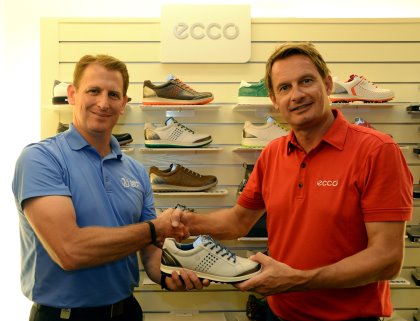 Asian Tour CEO Josh Burack being presented with a ECCO shoe by Jesper S. Thuen, Head of Golf-Asia Pacific