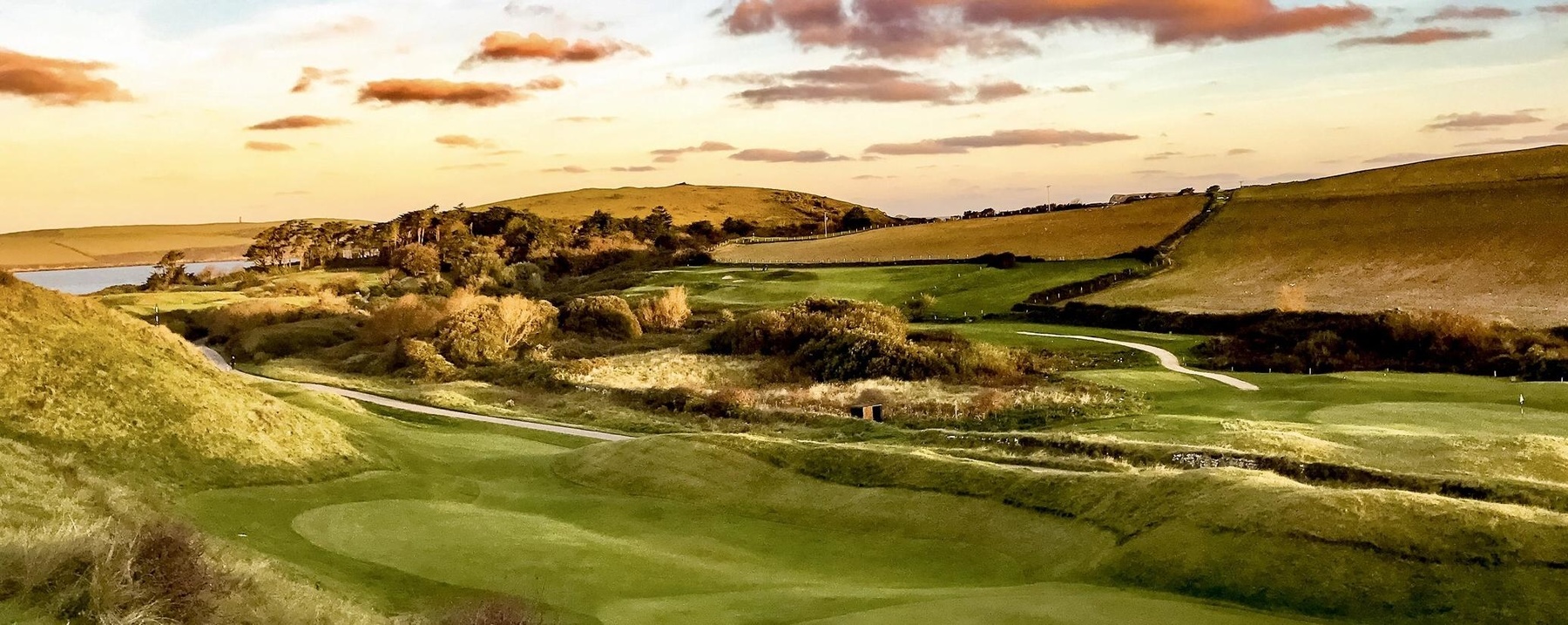 The 6th cropgreen at St Enodoc with the 4th hole in the background.