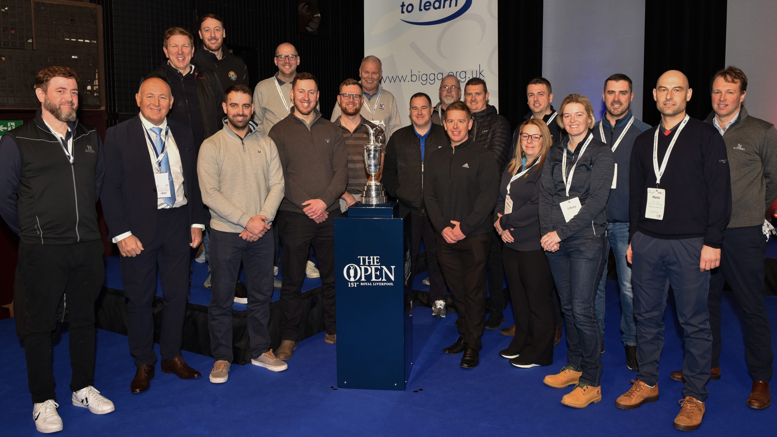 Previous members of The Open Volunteer Support Team joinerd the Claret Jug on stage at BTME in January
