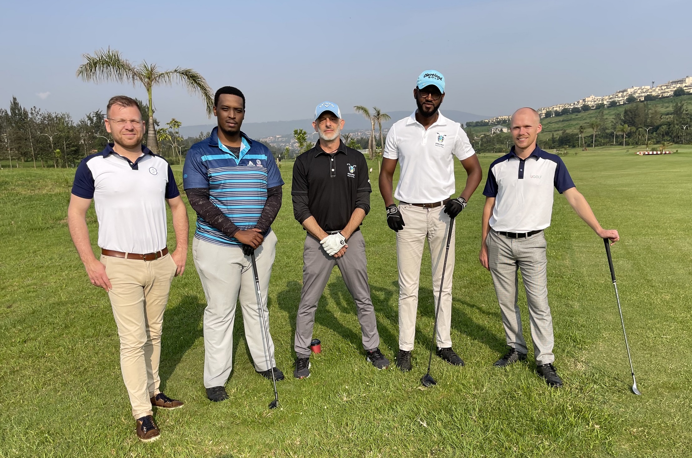 Nathanaël Pietrzak-Swirc (left), UGolf International CEO, with officials from Kigali Golf Resort (small)