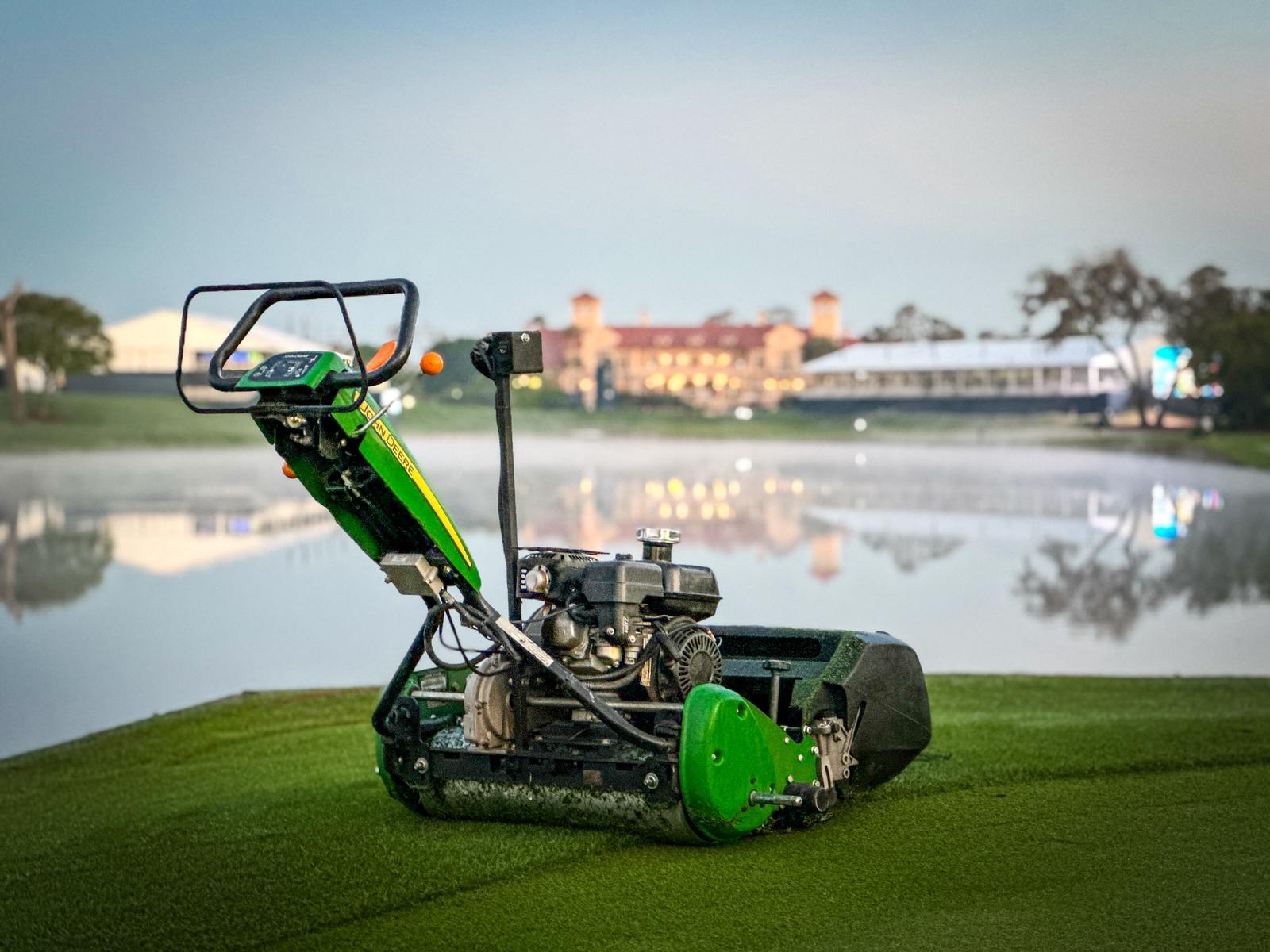 A John Deere push mower on the 18th tee at TPC Sawgrass by Alex Brougham